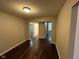 Hallway featuring wood flooring and neutral paint, connecting various rooms at 3837 Candle Berry Dr, Indianapolis, IN 46235