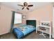 Cozy bedroom with a playful theme, featuring a comfortable bed, desk, and natural light from the window at 3873 Crest Point Dr, Noblesville, IN 46062