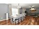 Dining area features wood floors, a chandelier, and a full dining set at 3873 Crest Point Dr, Noblesville, IN 46062