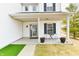 A covered front porch includes a small table and chair set at 3873 Crest Point Dr, Noblesville, IN 46062