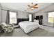 Spacious main bedroom with large windows, ceiling fan, and neutral color palette for a serene atmosphere at 3873 Crest Point Dr, Noblesville, IN 46062