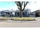Charming single-story home with a fenced yard and inviting curb appeal on a sunny day at 4113 Fletcher Ave, Indianapolis, IN 46203