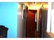 Well-lit hallway with hardwood floors, neutral walls, and classic trim creating a welcoming space at 4113 Fletcher Ave, Indianapolis, IN 46203