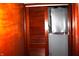 A storage room with brown wooden doors and a gray object at 4113 Fletcher Ave, Indianapolis, IN 46203