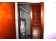 Storage room with brown wooden doors and a gray object at 4113 Fletcher Ave, Indianapolis, IN 46203