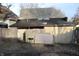 Fenced backyard features a small barbecue and view of the home's exterior at 416 Ketcham St, Indianapolis, IN 46222