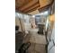 Outdoor area with storage and access to a backyard with a wooden fence at 416 Ketcham St, Indianapolis, IN 46222