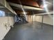 Large unfinished basement with concrete floor and exposed wood ceiling beams at 4616 N Kenmore Rd, Indianapolis, IN 46226