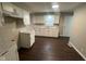 Updated kitchen with stainless steel sink, light cabinets, and modern fixtures at 4616 N Kenmore Rd, Indianapolis, IN 46226