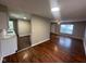 Open-concept floor plan featuring wood floors, seamlessly connecting kitchen to the living area at 4616 N Kenmore Rd, Indianapolis, IN 46226
