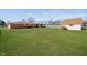 Large backyard with maintained lawn features a brick home and an outbuilding at 4812 Southview Dr, Anderson, IN 46013