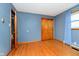 Bedroom with hardwood floors, single window, and closet at 4812 Southview Dr, Anderson, IN 46013