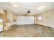 Spacious two car garage features a functional garage door, water heater and brick detail at 4812 Southview Dr, Anderson, IN 46013
