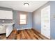 Cozy kitchen nook with a window, built-in shelving and stylish wood-look flooring at 4812 Southview Dr, Anderson, IN 46013