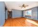 Spacious living room with hardwood floors, a ceiling fan, natural light and an open layout at 4812 Southview Dr, Anderson, IN 46013
