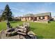 Large backyard with fire pit, lawn and patio great for entertaining at 5079 Stonespring Way, Anderson, IN 46012