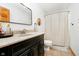 Well-maintained bathroom with a vanity, mirror, and neutral decor at 5079 Stonespring Way, Anderson, IN 46012