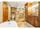 Luxurious bathroom with a glass shower, beautiful cabinets and countertops, and a freestanding tub at 5079 Stonespring Way, Anderson, IN 46012