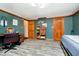 Stylish bedroom with wood floors, natural light, and unique decor accents at 5079 Stonespring Way, Anderson, IN 46012