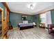 Cozy bedroom features wood floors, natural light, and relaxing retreat space at 5079 Stonespring Way, Anderson, IN 46012