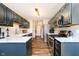 Open kitchen showcasing painted cabinets, sleek countertops, and a full suite of stainless steel appliances at 5079 Stonespring Way, Anderson, IN 46012