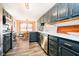 Modern kitchen boasts stainless steel appliances, painted cabinets, and a bright, open dining area at 5079 Stonespring Way, Anderson, IN 46012