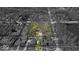 Aerial view of land with lot lines, showcasing the layout and surrounding greenery at 7016 Evanston Ave, Indianapolis, IN 46220