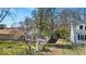 Charming home on a lush lot, showcasing the exterior with mature trees surrounding the property at 7016 Evanston Ave, Indianapolis, IN 46220