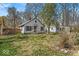 Charming home featuring a cozy front porch and mature trees in the front yard at 7016 Evanston Ave, Indianapolis, IN 46220