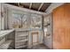 Sun room with multiple windows provides a lot of light plus a view of the backyard at 7016 Evanston Ave, Indianapolis, IN 46220