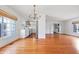 Spacious open-plan living room with hardwood floors, white trim and lots of natural light at 7844 N Audubon Rd, Indianapolis, IN 46250
