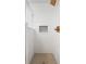 Tiled shower with penny tile floor and subway tile walls accented by a built-in niche at 7844 N Audubon Rd, Indianapolis, IN 46250