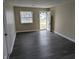 Spacious living room with updated floors and natural light at 8002 Bryan Dr, Indianapolis, IN 46227