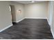 Open-concept living area showcases updated flooring and easy access to kitchen at 8002 Bryan Dr, Indianapolis, IN 46227