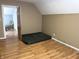 Upper-level bedroom featuring wood-look floors, neutral paint, and an ensuite bathroom at 804 N Jameson St, Lebanon, IN 46052