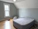 Upstairs bedroom with slanted ceilings, natural light, and neutral paint colors at 804 N Jameson St, Lebanon, IN 46052