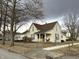 Charming two-story home featuring a covered front porch with a seating area and classic architectural details at 804 N Jameson St, Lebanon, IN 46052