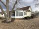 Charming home featuring a screened porch with natural light, nestled among mature trees and green landscaping at 804 N Jameson St, Lebanon, IN 46052