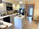 Spacious kitchen with sleek appliances, center island, and views into the adjacent room, perfect for entertaining at 804 N Jameson St, Lebanon, IN 46052
