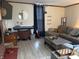 Cozy living room featuring a gray sofa, wooden coffee tables, and decorative elements for a comfortable atmosphere at 804 N Jameson St, Lebanon, IN 46052