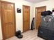 This room features three wooden doors and light-colored flooring, with one area used for storing guns and a safe at 804 N Jameson St, Lebanon, IN 46052
