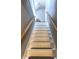Bright staircase with white painted steps and wooden handrails leading to the upper level at 804 N Jameson St, Lebanon, IN 46052