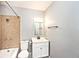 Full bathroom with white vanity, shower-tub combination and decorative tile at 8139 Laughlin Dr, Indianapolis, IN 46219