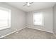 Bedroom with neutral paint and carpet and two windows for natural light at 8139 Laughlin Dr, Indianapolis, IN 46219