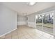 Bright dining area with neutral paint, tile flooring, and backyard access via sliding glass door at 8139 Laughlin Dr, Indianapolis, IN 46219