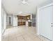 Open kitchen features tile floors, oak cabinetry and white appliances at 8139 Laughlin Dr, Indianapolis, IN 46219