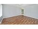 Spacious living room with modern wood-look floors and neutral walls at 8139 Laughlin Dr, Indianapolis, IN 46219