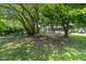 Backyard space with mature trees provides shade and privacy at 818 S Grant St, Muncie, IN 47302