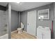Bathroom with tub-shower combination and vanity offer functionality and a neutral color palette at 818 S Grant St, Muncie, IN 47302