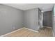Neutral bedroom with good natural light with access to an adjacent room via an open doorframe at 818 S Grant St, Muncie, IN 47302